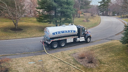 Stewart Septic Services truck pumping a residential septic system
